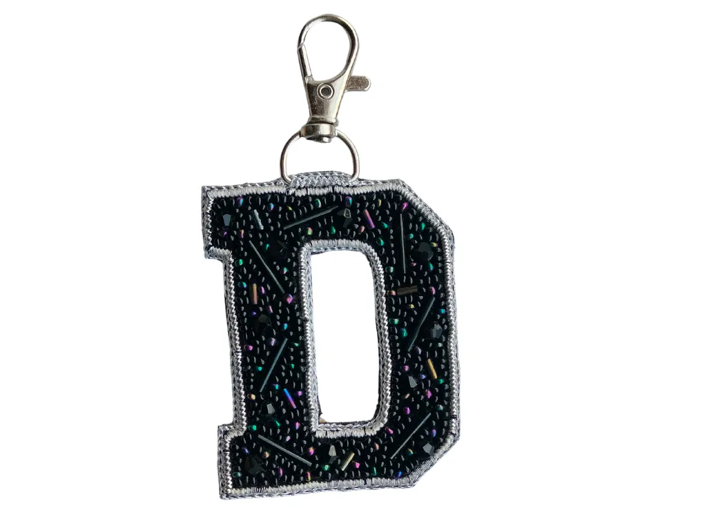 Black Cutdana 'D' Alphabet Bag Charm